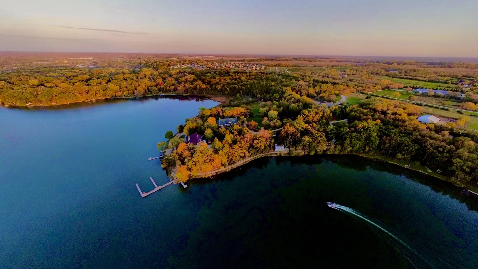 Aerial view of a lake and fall woods in Southeast Wisconsin